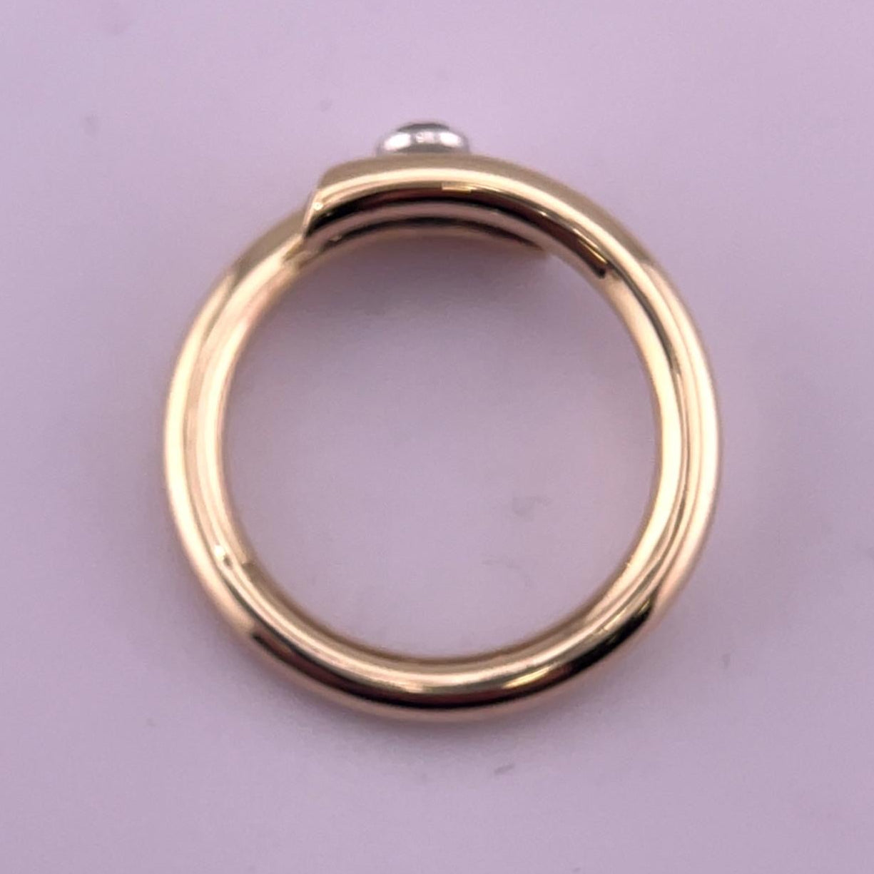 Tilted 9ct gold crossover ring set with 0.23ct of natural diamonds.