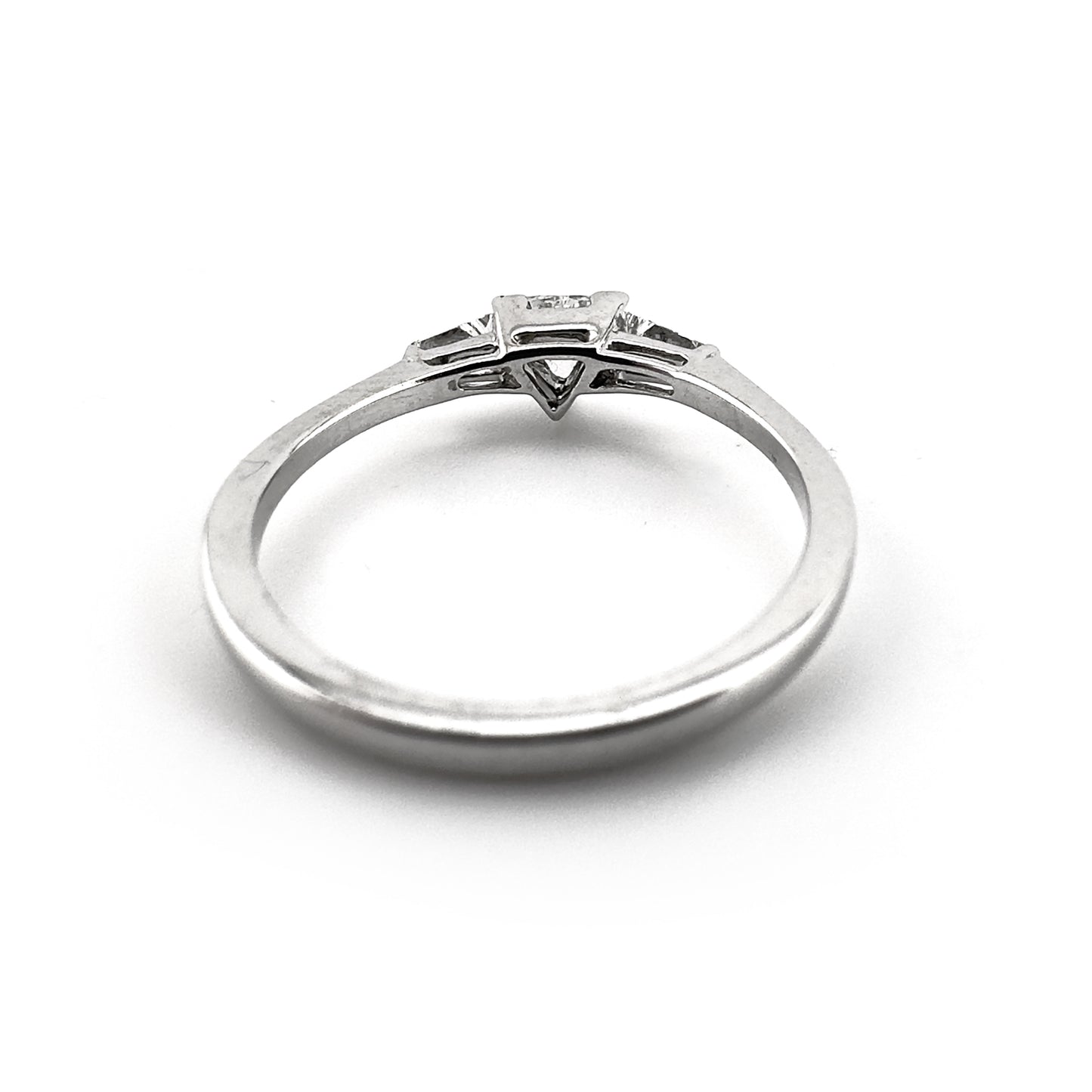 Trillion diamond ring with two tapered baguette cut shoulders, 18ct white gold