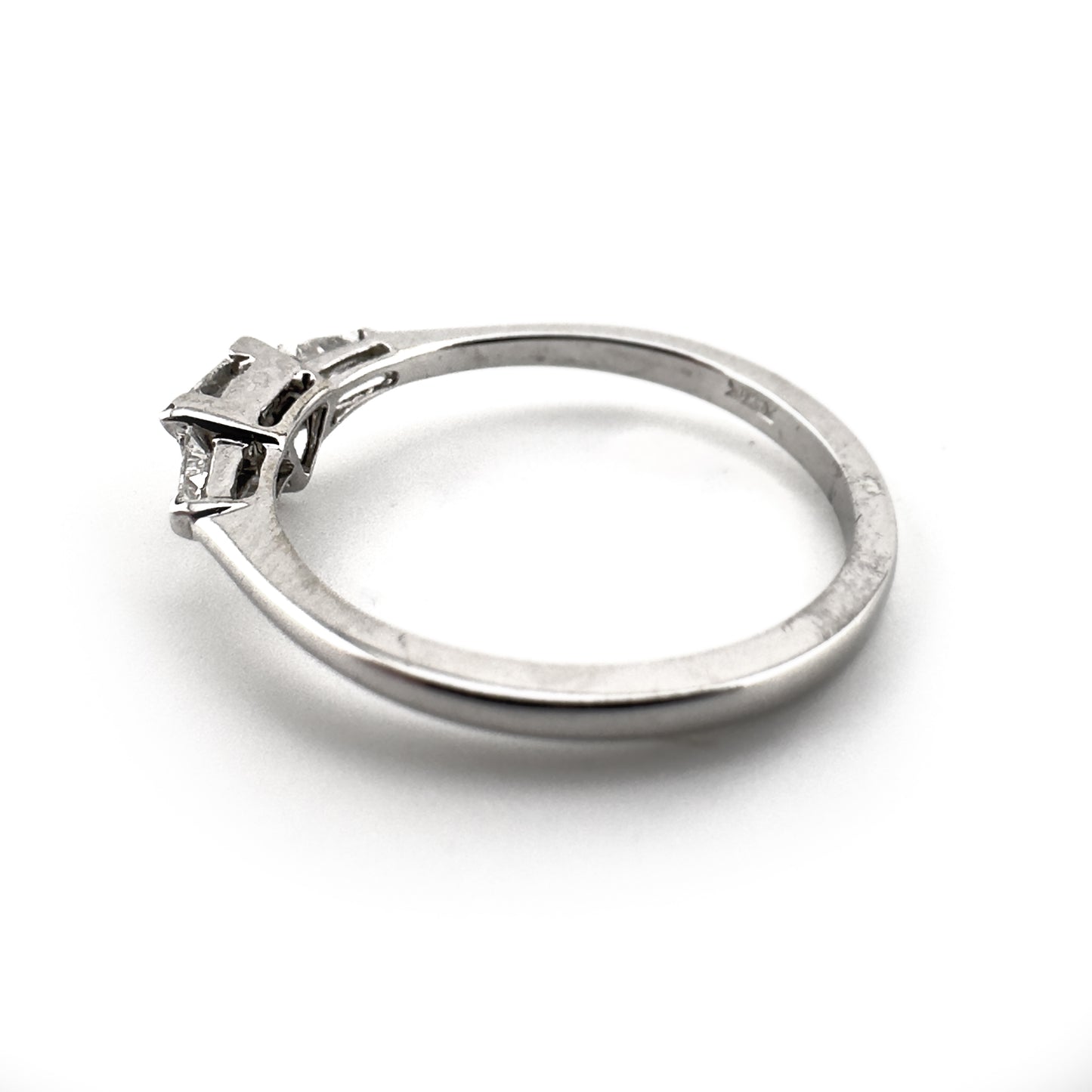 Trillion diamond ring with two tapered baguette cut shoulders, 18ct white gold