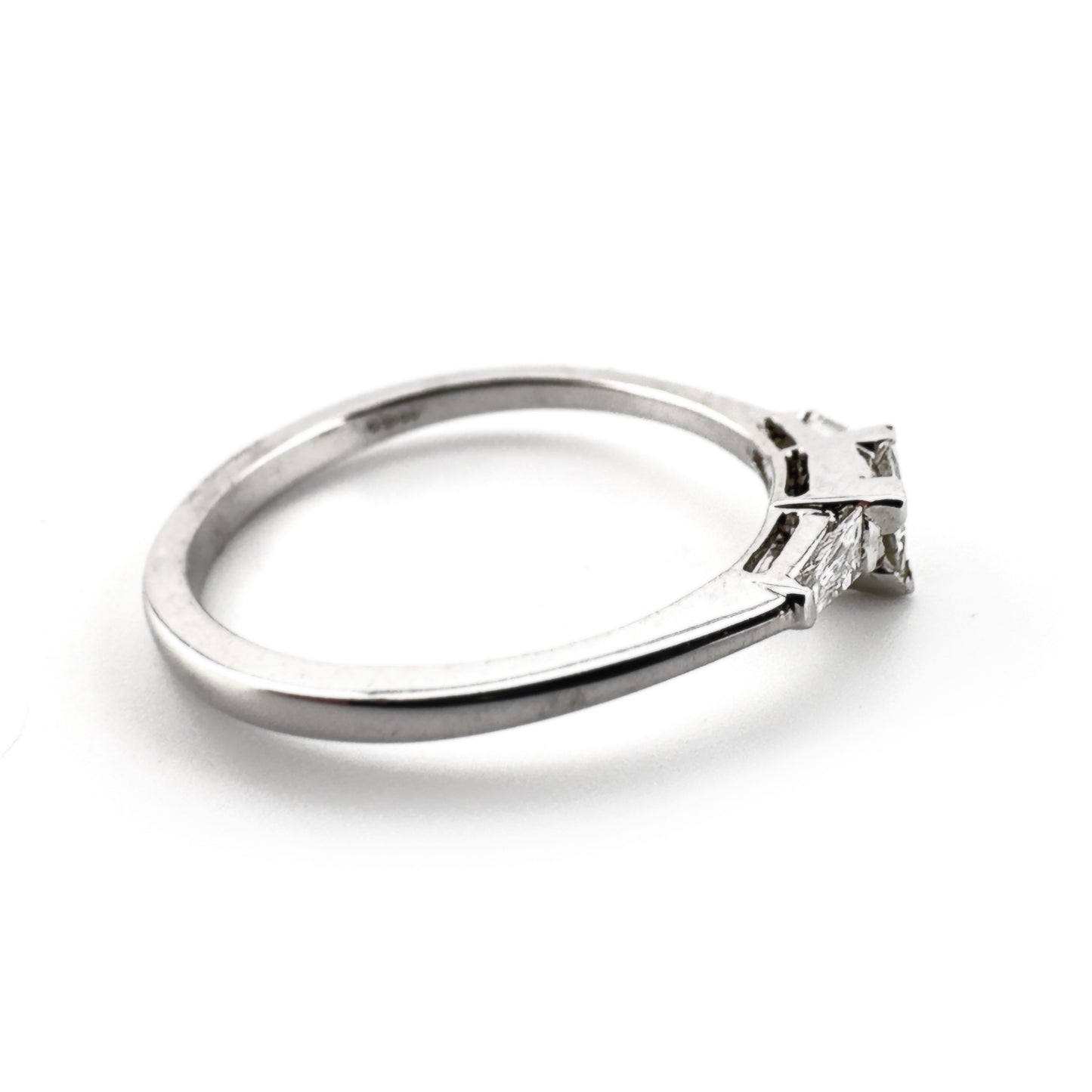 Trillion diamond ring with two tapered baguette cut shoulders, 18ct white gold