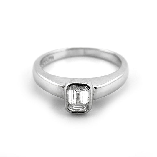 Emerald cut diamond rubover ring, platinum