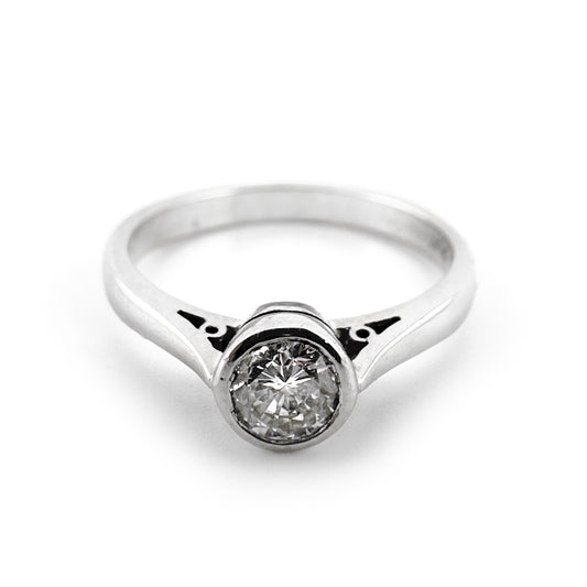 Diamond solitaire rubover ring, round brilliant cut, platinum