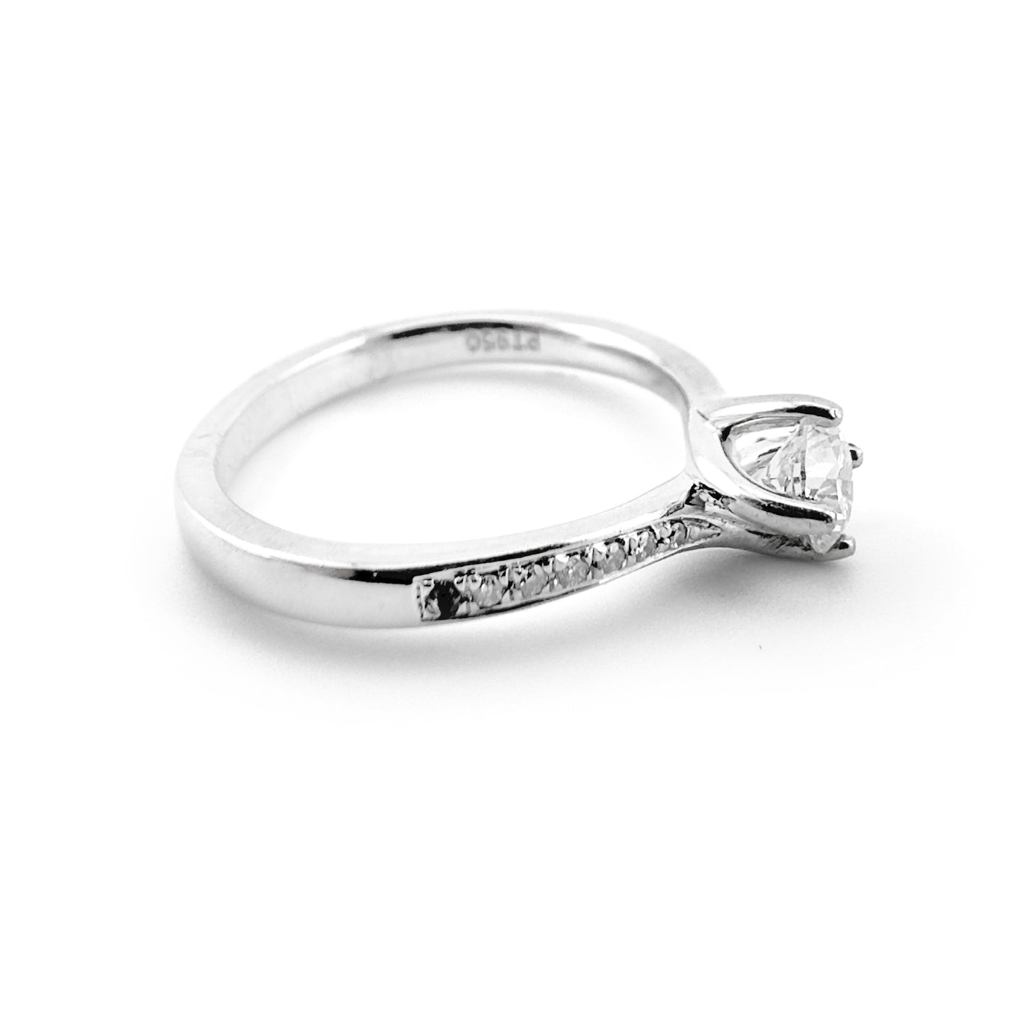 Diamond solitaire ring with diamond shoulders, platinum