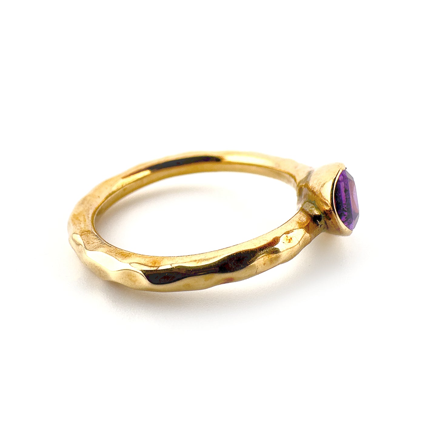 Tilted amethyst ring, 9ct yellow gold with hammered finish to band